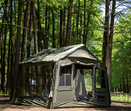 SEKACAMP Square Air Tent 8 in olive with mesh panels open at a forest campsite